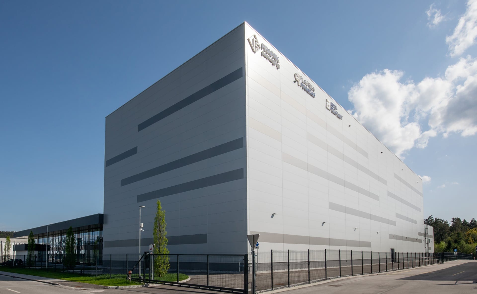 The white FlexPET production facility in Slovenia under a blue sky