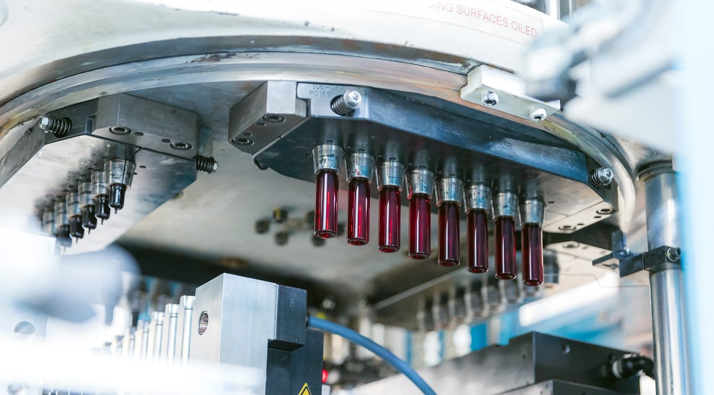 PET preforms in a blow-moulding machine at the FlexPET factory
