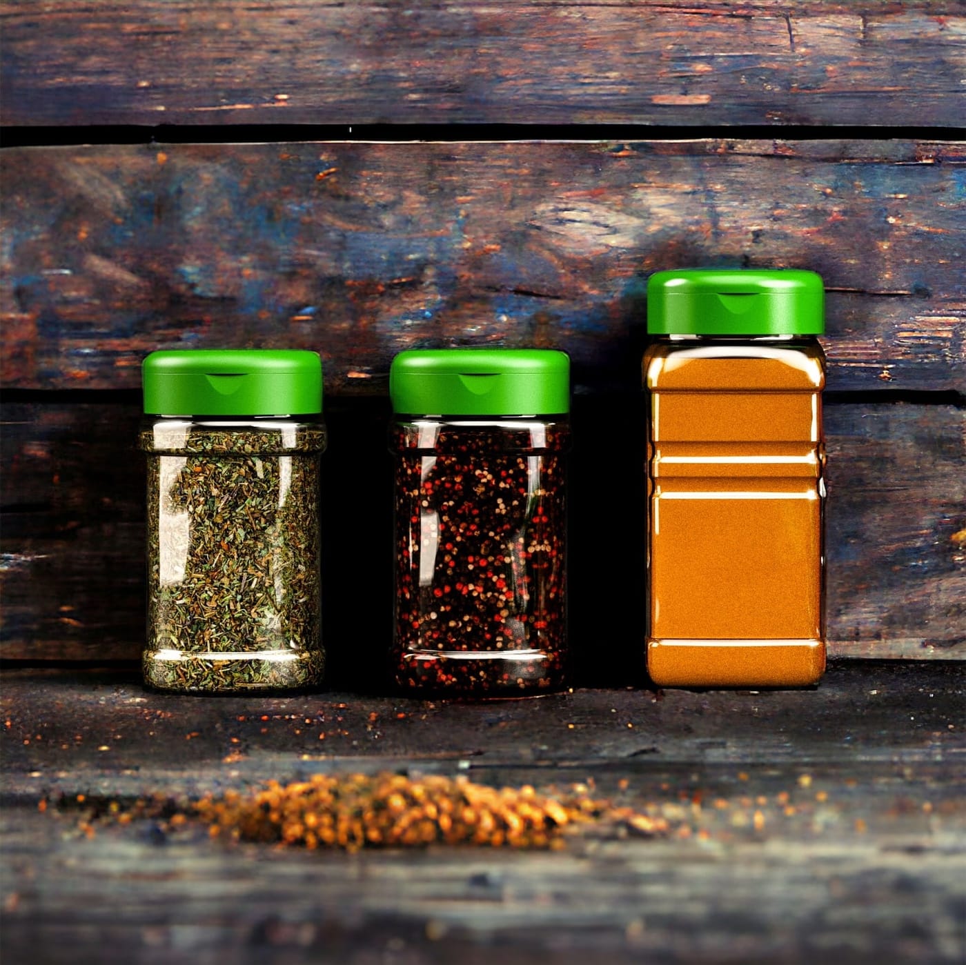 PET spice jars with black caps on a wooden kitchen surface